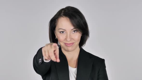 Portrait of Businesswoman Pointing at Camera