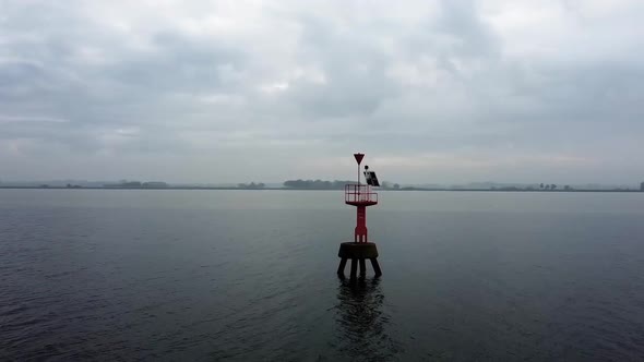 Flying around a light buoy with a drone.