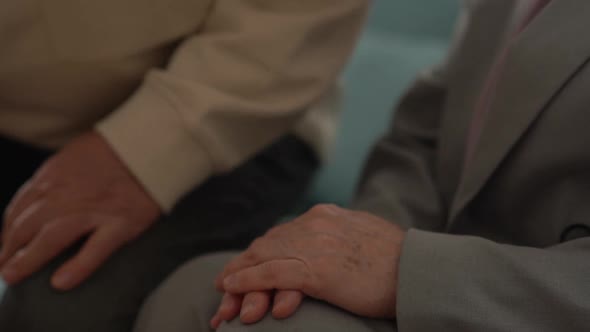Closeup of the Hands of Older People a Man and a Woman Supporting and Loving Each Other