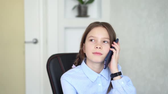 Young Girl Using Smartphone While Sitting at Home