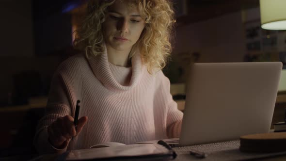 Handheld video of woman working intensively at home.  Shot with RED helium camera in 8K.