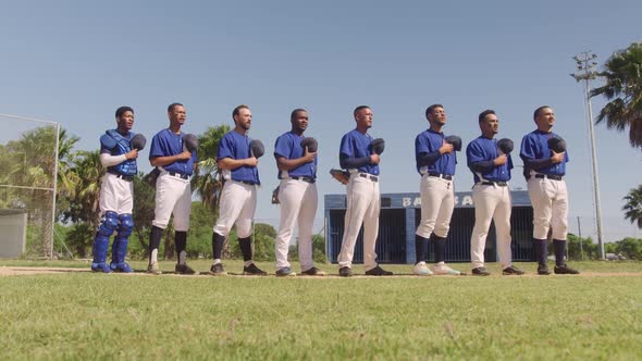 Baseball players standing on line