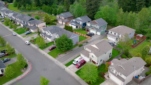 Drone shot of suburban houses in a unique American neighborhood layout.