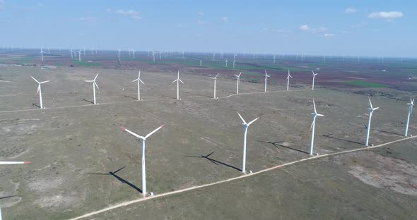 4K aerial view of windmills farm. Modern wind turbines.
