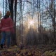 Owner Walks Dog in Forest at Sunset - VideoHive Item for Sale