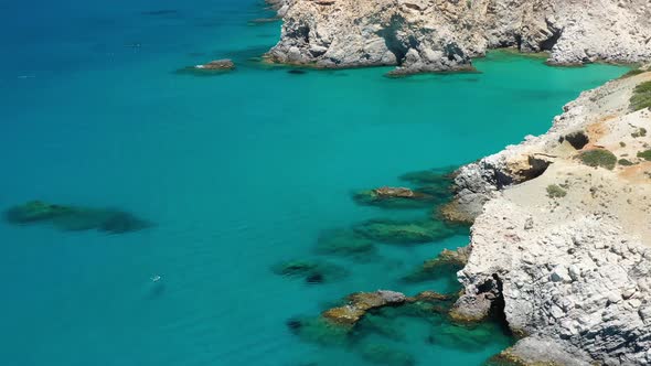 Aerial seascape at the day time. Bay and rocks. Blue water background in the summer.