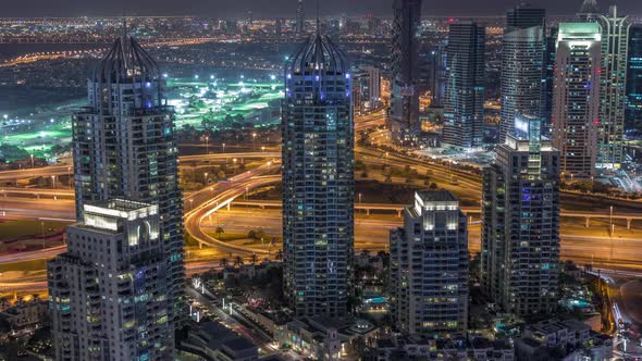 Dubai Marina Skyscrapers and Jumeirah Lake Towers View From the Top Aerial Night Timelapse in the