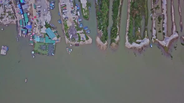 A dynamic top-down aerial footage of the fishing village in Lau Fau Shan in the New Territories of H