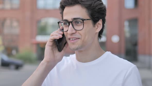 Young Man Talking on Phone