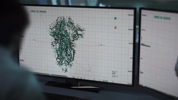 Doctor looking up Covid-19 spike protein structure and preparing for a CT scan alt