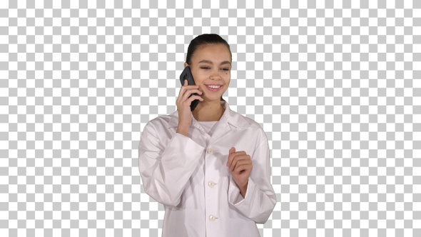 Smiling female doctor on the phone talking while walking Alpha