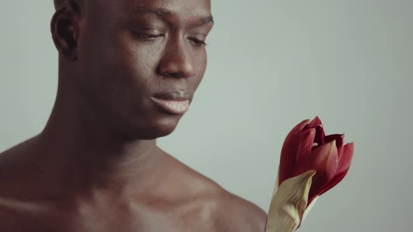 Black Man With Red Flower Bud