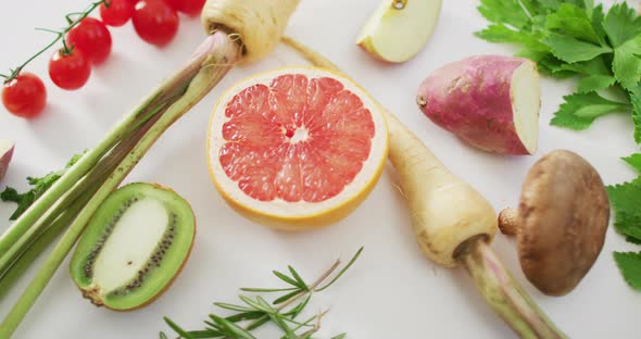 Video of fresh fruit and vegetables on white background