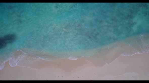 Aerial tourism of marine lagoon beach journey by aqua blue lagoon with white sandy background of a d
