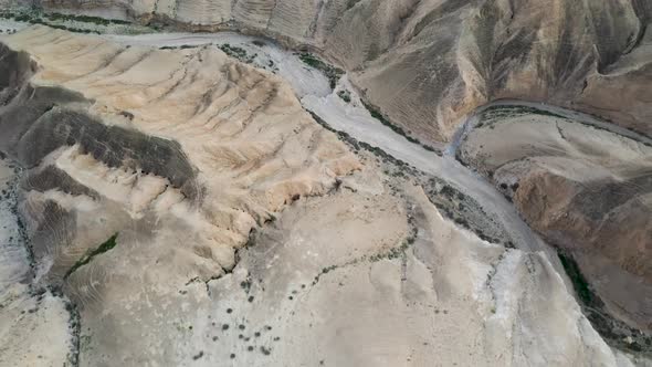 aerial view of dry river path in Judea desert hills, Israel