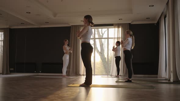 In Slow Motion a Yoga Instructor Conducts a Group Lesson for Women of Different Ages and Weight