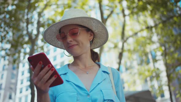 A smiling girl with a mobile phone