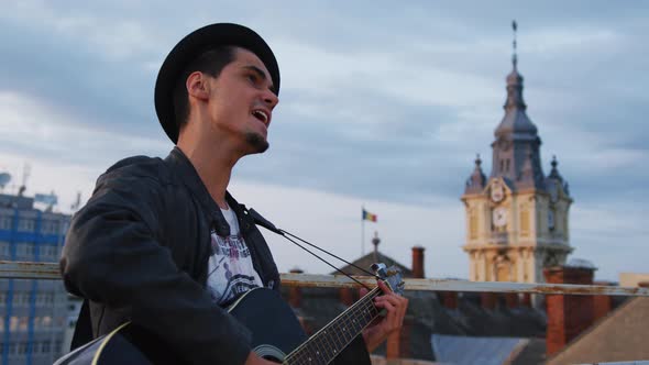 Man playing guitar and singing