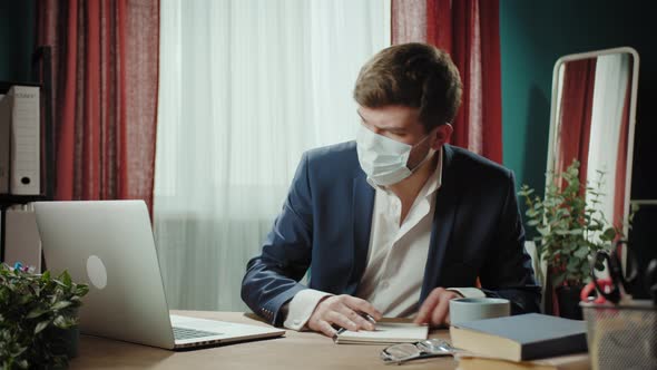 Executive Senior CEO Businessman in Medical Mask Working Online on Laptop Remote Office Man Typing