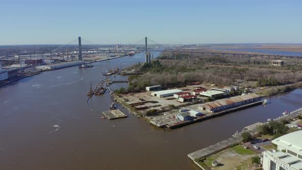 Savannah River waterfront warehouses with Talmadge Memorial Bridge in view