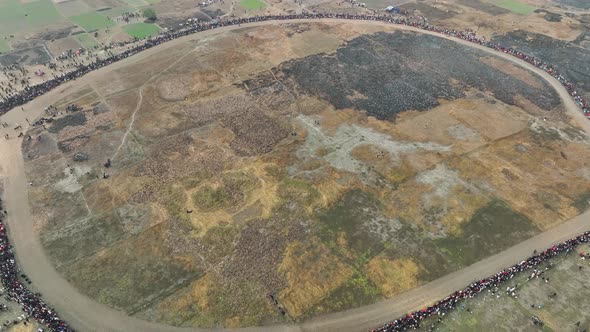 Aerial view of people watching horse race in Mohanpur, Bangladesh. alt