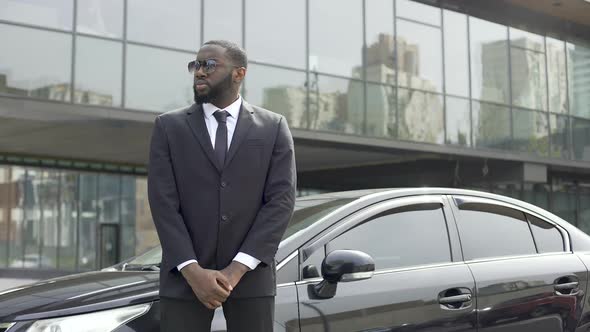 Huge Afro-American Security Chief Monitoring Order Outside Business Center