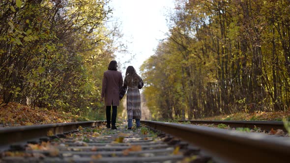 Romantic Walk of Loving Couple in Autumn Day Strolling on Old Railway Road