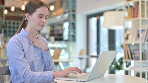 Professional Young Businesswoman Coughing in Caf�