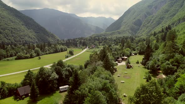 Aerial view of summer camp with small camping cabins and recreational area.