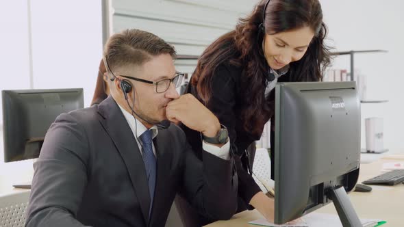 Business People Wearing Headset Working in Office