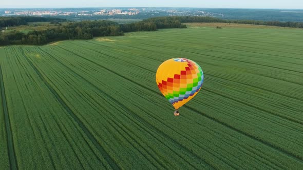 Hot Air Balloon in the Sky Over a Field.