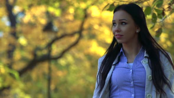 Slowmotion Detail of Young Beautiful Calm Woman Who Goes and Observe Landscape in Park