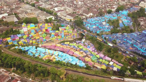 Colorful Village Air Flight while Train passing on a moody day, East Java, Indonesia