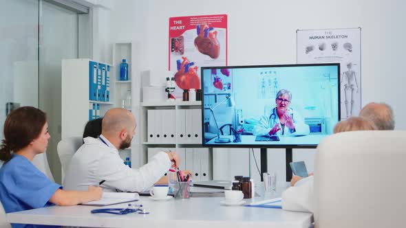 Professional Teamworkers Watching Instructional Medical Videos