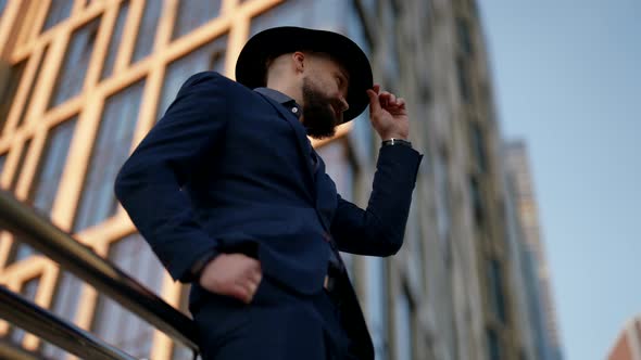 Elegant Man is Waiting Someone on City Street in Modern District Handsome Guy with Moustache