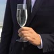Man in Business Suit Holding Champagne Glass at Corporate Roof Party Celebration - VideoHive Item for Sale