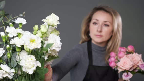 Florist Arranges Romantic Flower Bouquet with Fresh Roses