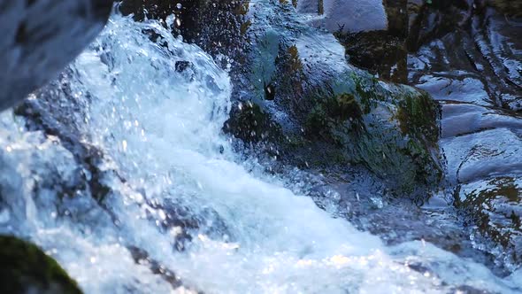 Showing Water Rush Down Small Rapids Into Stream 2