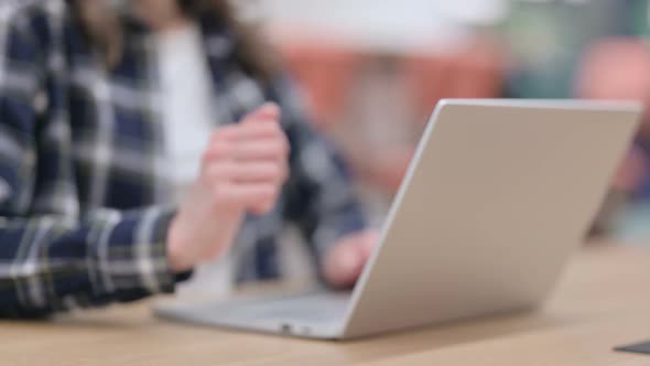 Female Doing Hand Shake Gesture While Using Laptop Close Up