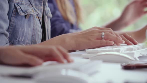 Close Up Shot of Businesswoman Hand Typing and Working on Computer on Desk