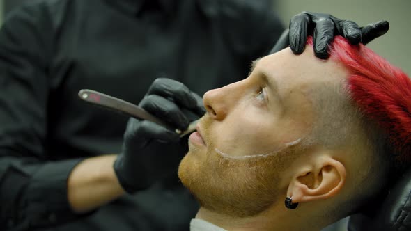 The Master Hairdresser Makes the Customer Even with a Straight Razor