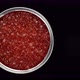 Red caviar in jar top view, rotate. Lots of red caviar. Place for text. 4K UHD video - VideoHive Item for Sale