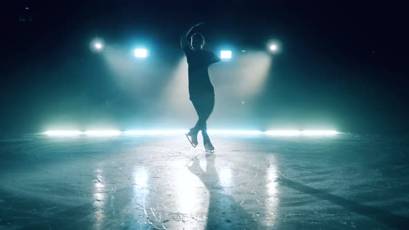 Young Lady is Practicing Ice Skating and Doing Spins