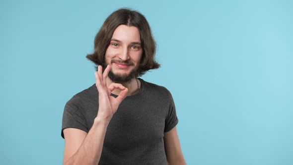 Portrait of Bearded Guy in Casual Showing Ok Symbol Meaning Good Successful Result or Choice Over