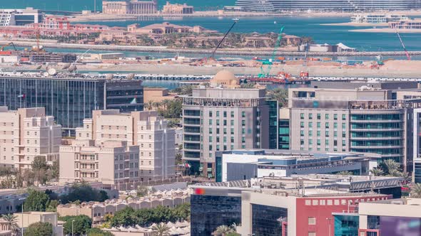 Dubai Media City Buildings and Palm Jumeirah on Background Timelapse Dubai United Arab Emirates