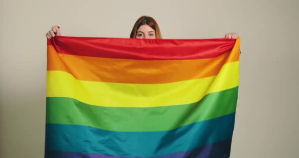 Ukrainian Girl Holding a Multi Color Peace Flag