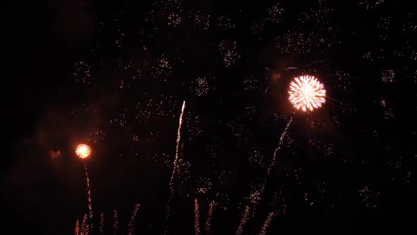Colorful real fireworks show performance display celebration festival holiday on dark sky.