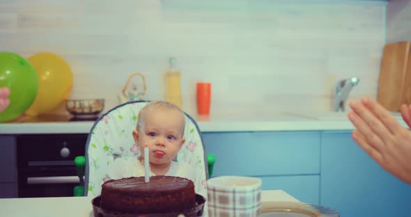 Kid Looks at the Blown Candle