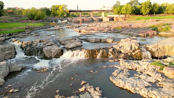 Aerial view of Falls Park in South Dakota. Three levels of falls seen with ducks swimming.