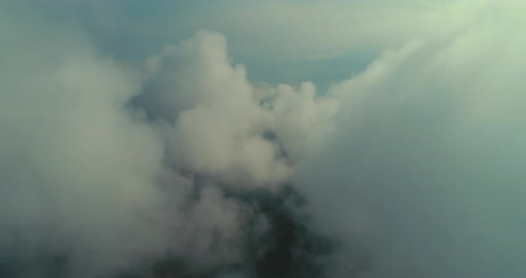 Aerial Fly Above Clouds with Blue Sky in Backgroubnd on Beautiful Sunny Day